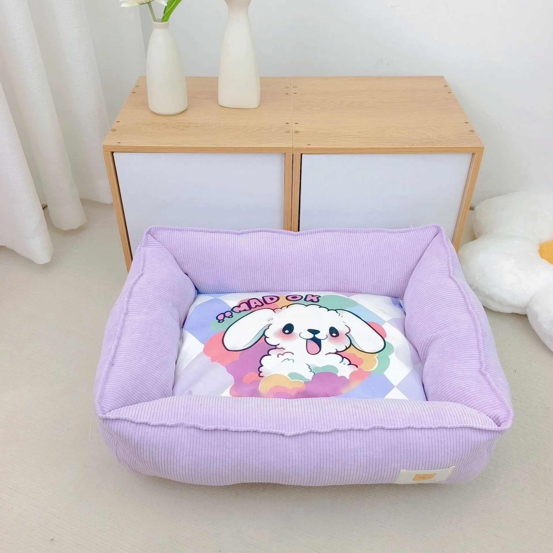 Soft fabric pet winter bed for dogs and cats in light blue colour, showing plush velvet texture.