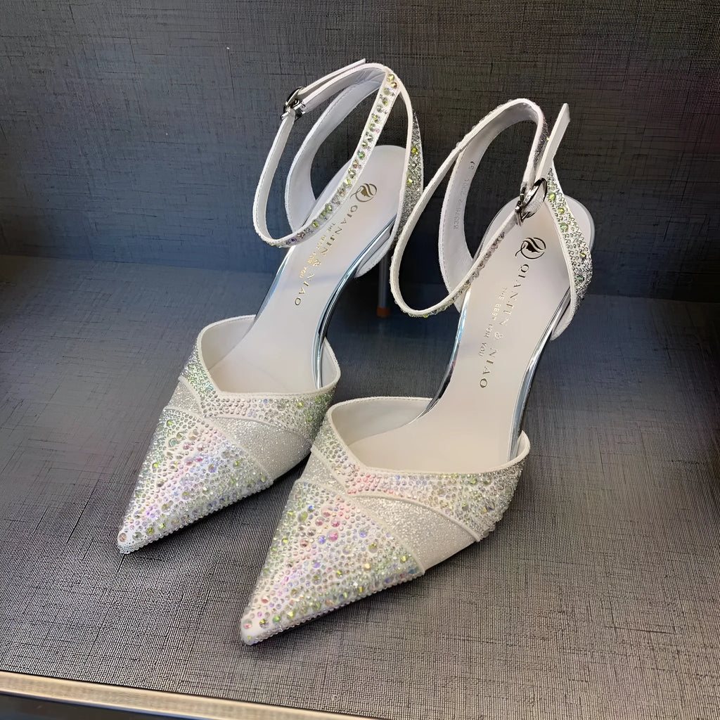 Women's black stiletto high heels with red sole and pointed toe design