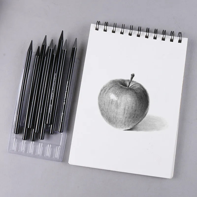 Set of six graphite and three carbonized drawing pencils with wooden casings on a suction card.