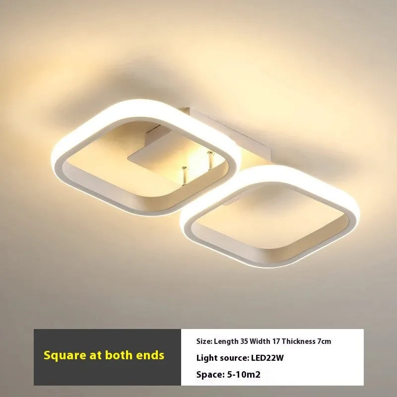 Modern simplicity hallway LED ceiling light in black with three round shapes over a corridor