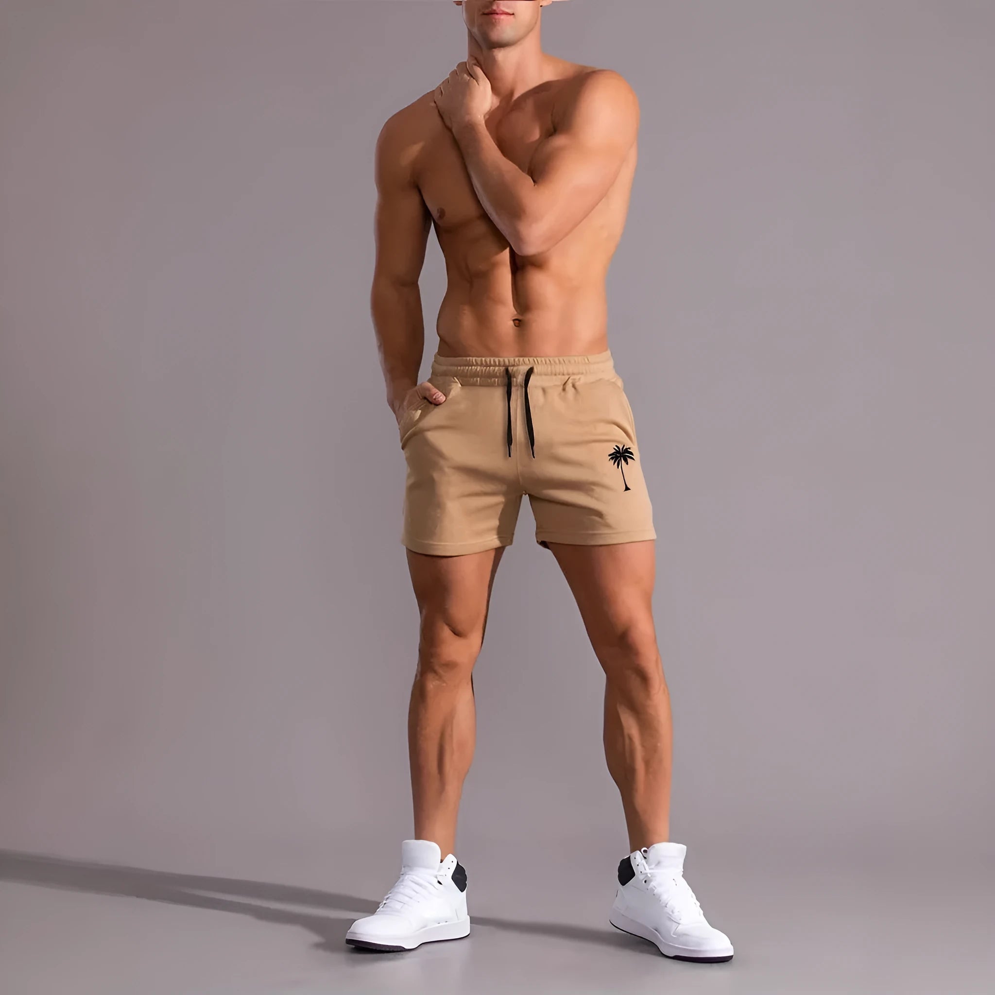 Khaki coloured men's sports shorts with coconut print design and straight cut for summer activities