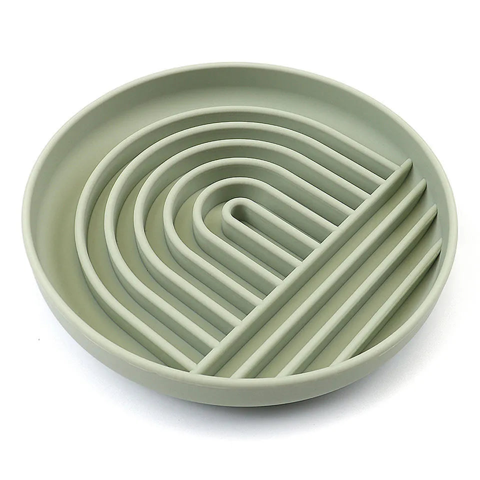 Silicone slow feeder dog bowl with textured ridges and nooks for slow eating, shown in assorted colours.