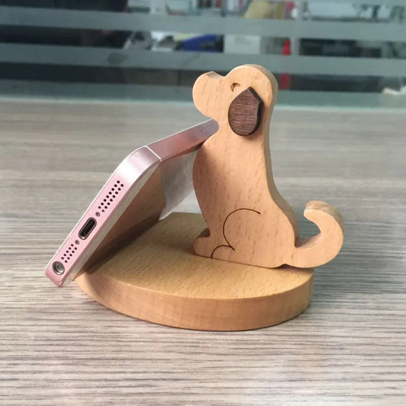 Beech wood mobile phone holder stand with coin slot and decorative carving.
