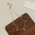 Zircon jewellery set showing necklace, earrings, and anklet with geometric meteor shower design