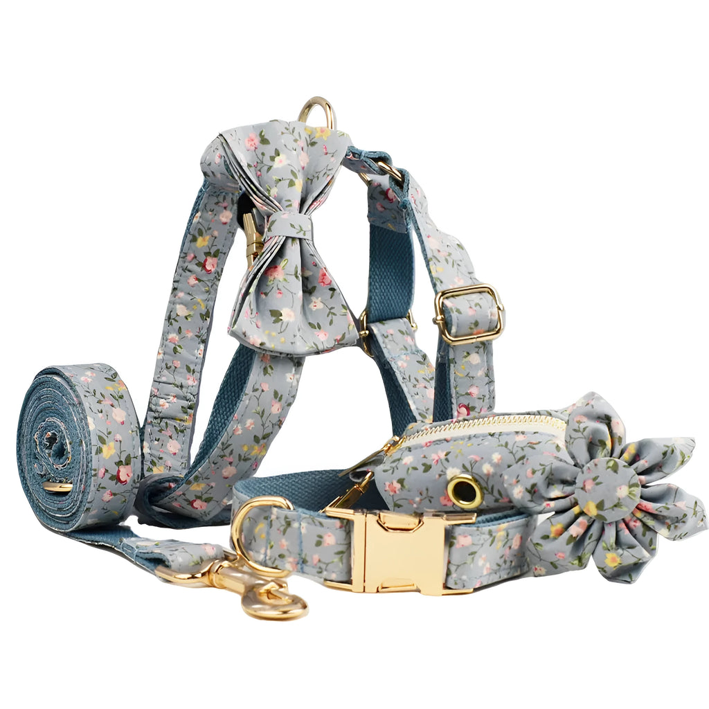 Blue floral pattern dog collar set with matching leash, bow, vest and waste bag dispenser accessories