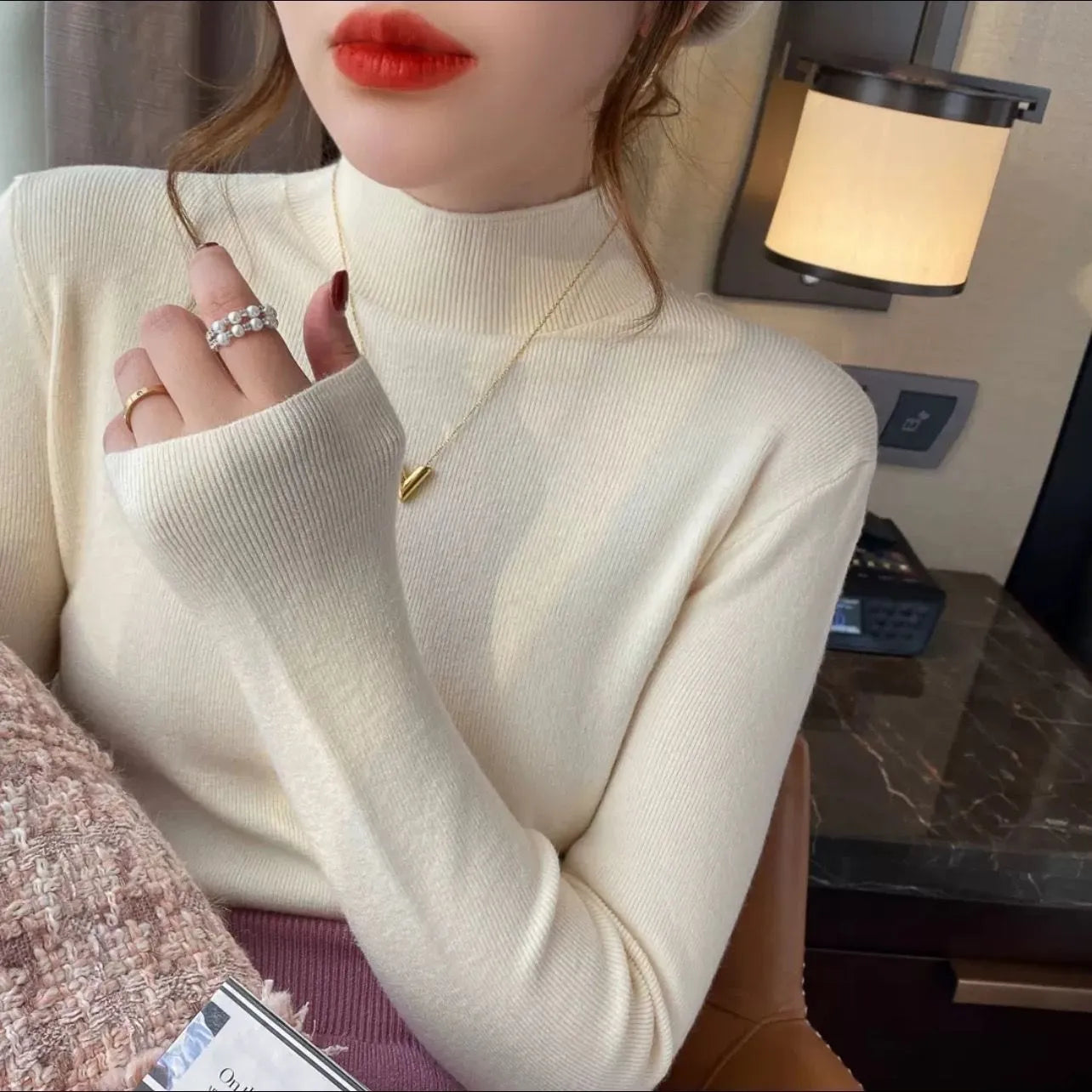 Slim fit long sleeve viscose bottoming shirt in apricot colour on a hanger