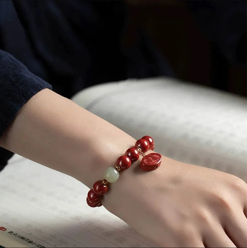 Natural cinnabar Emperor Sandstone Ping An Fu Lu bracelet in 8mm or 10mm bead size.