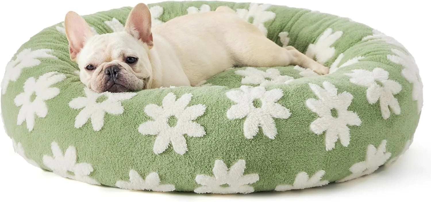 Round plaid-patterned dog bed on a floor, shown in a blue and white colour variant.