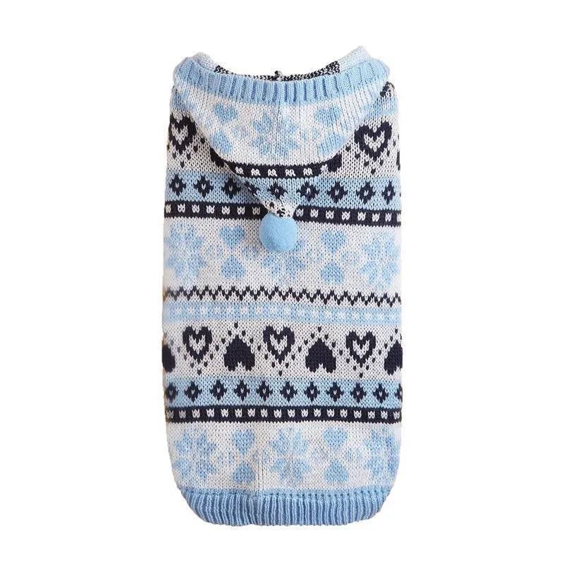 Blue striped camouflage knitted acrylic sweater on a small Bichon dog, showing snowflake and love heart patterns.