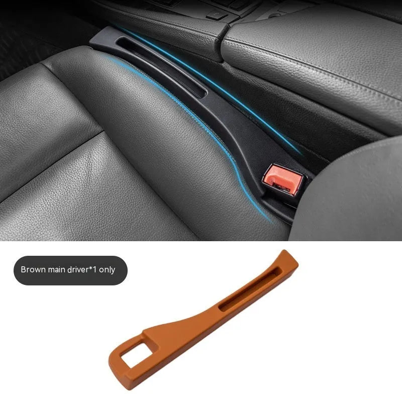 Black plastic car seat gap storage box with handle installed between car seats
