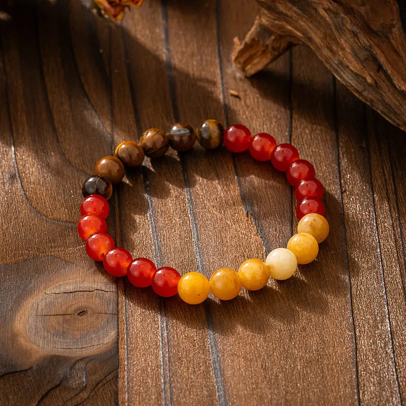 Vintage bohemian style natural stone bead necklace and bracelet set showing geometric round beads and tassel detailing