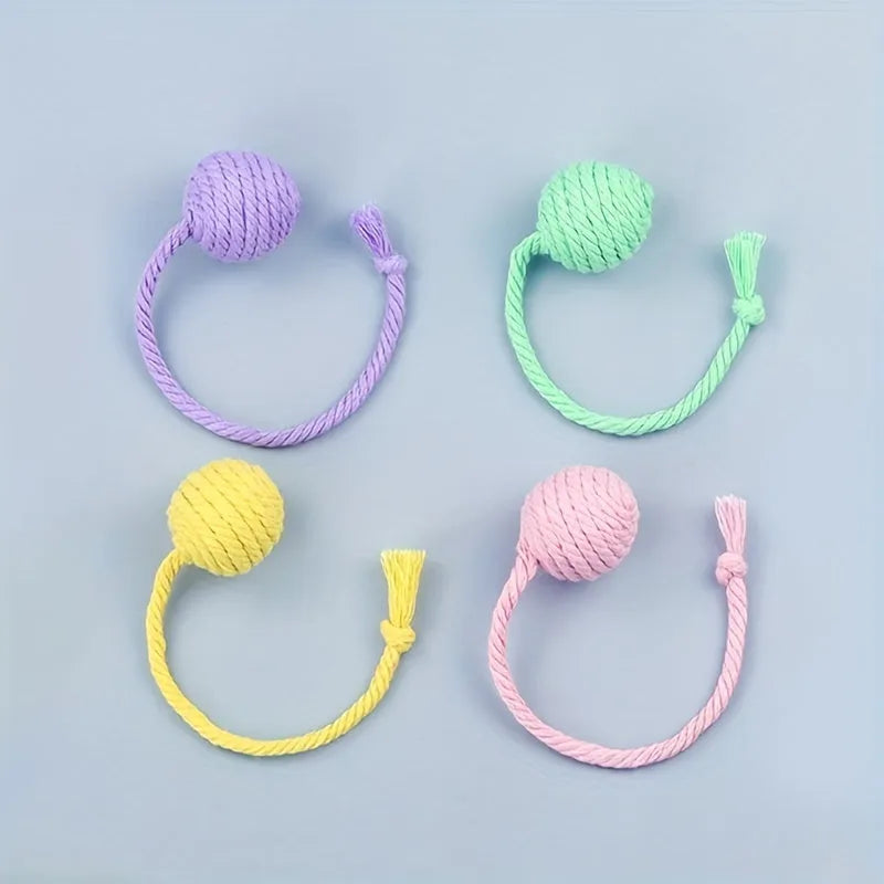 Colourful cat toy ball with rope tail and internal jingle bell in two size options