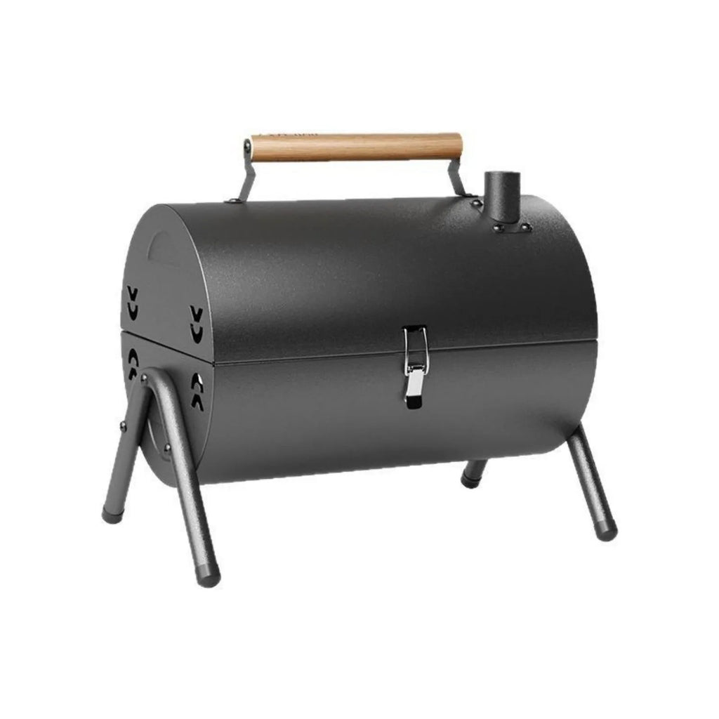 White portable folding barbecue grill with round chimney oven and cooking accessories