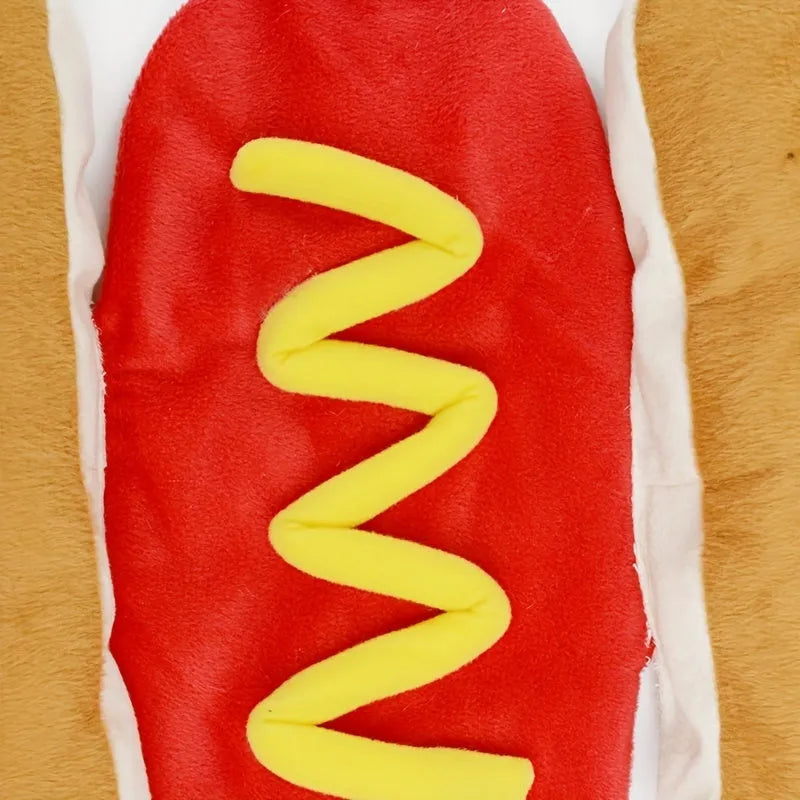 Small dog wearing a stuffed brown and beige hot dog costume with bun.