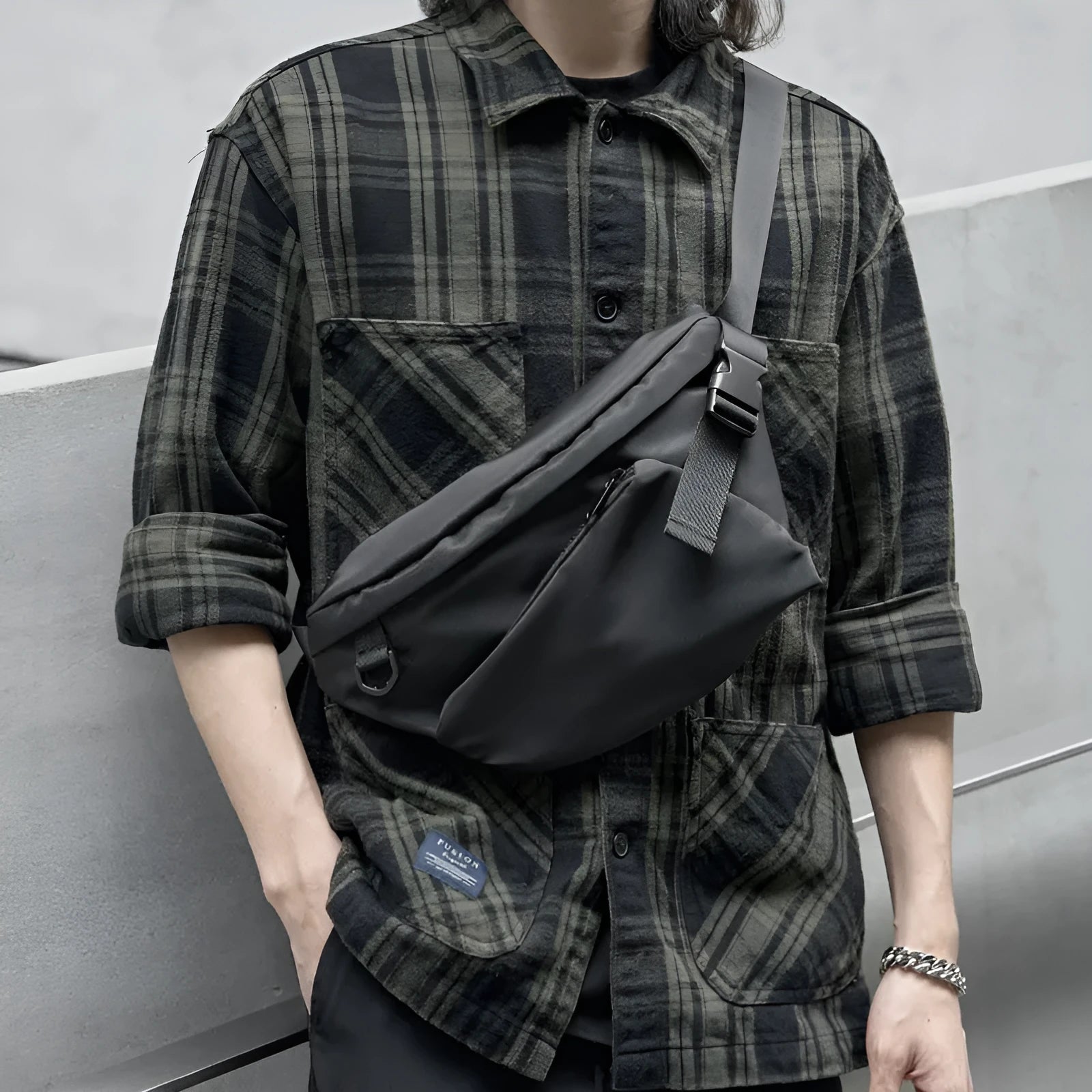 Black men's 8-inch slanted chest bag made from Oxford fabric with visible sewing line details