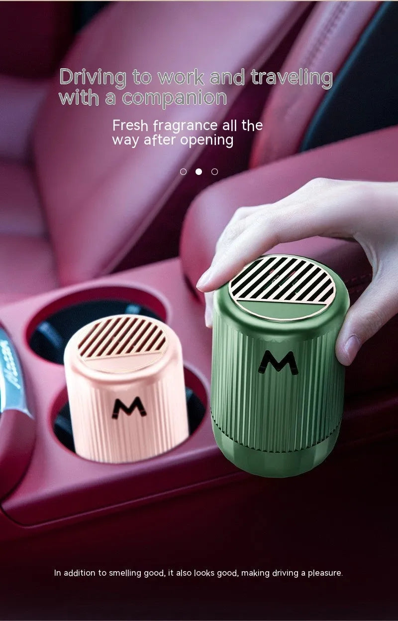 Solid car aromatherapy decoration cup in choice of four scents, dimensions 10 by 6 centimetres.