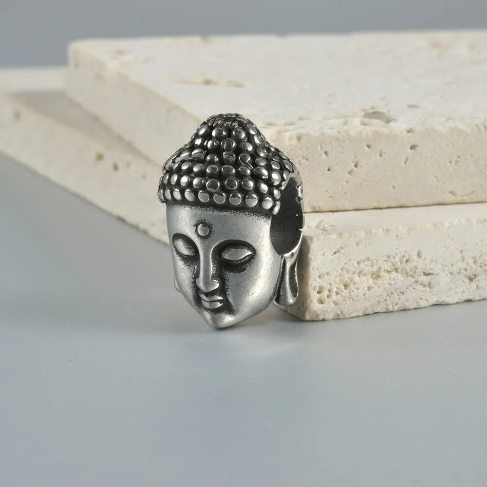 Stainless steel hollow skull Buddha earrings showing geometry shape and electroplated colour options