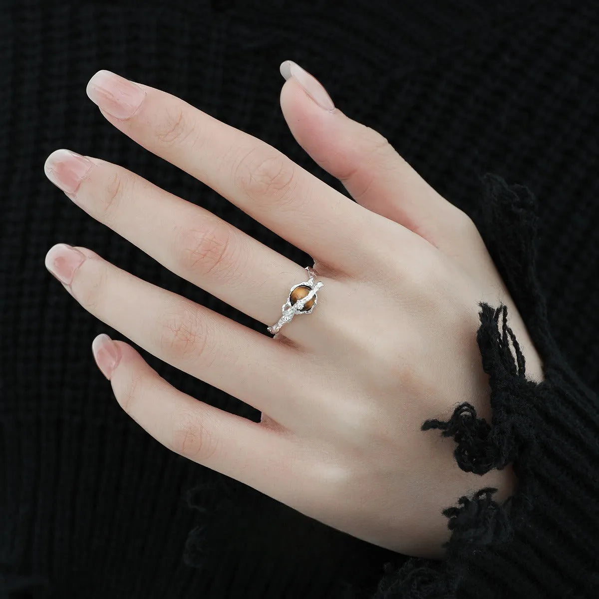 Adjustable opening Saturn ring in white gold colour tone on silver material