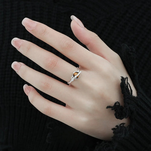 Adjustable opening Saturn ring in white gold colour tone on silver material