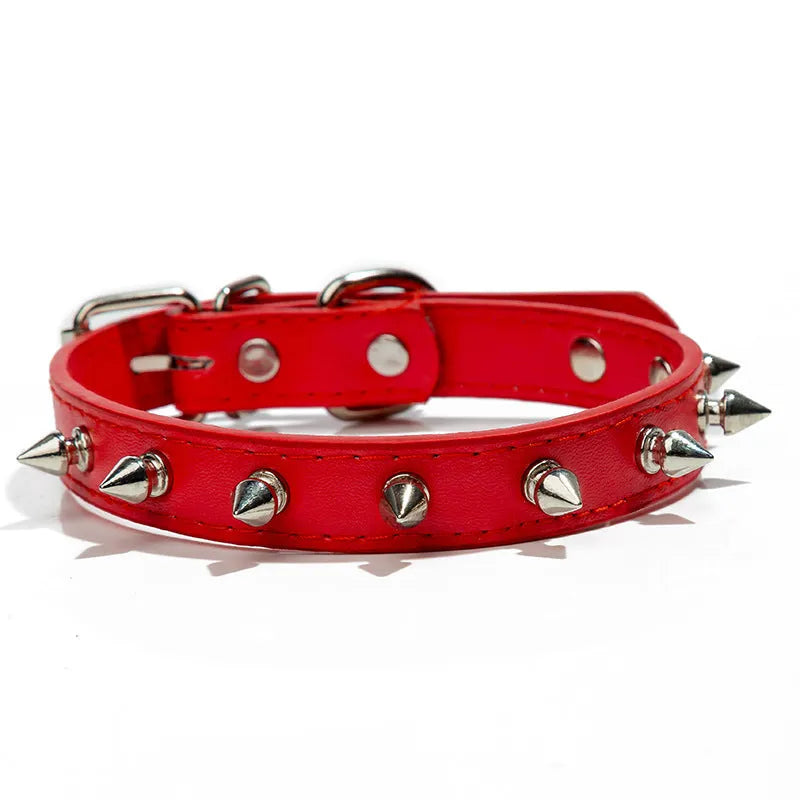 Studded dog collar in black PU leather with metal spikes and alloy buckle.