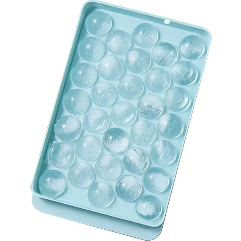 Large blue silicone ice cube tray with 33 round grids and a clear lid