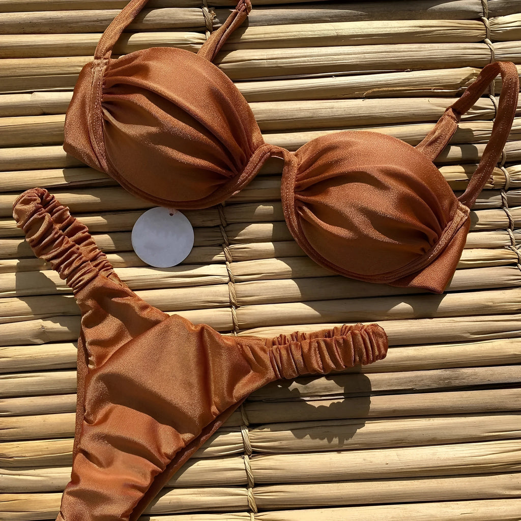 Women's black underwire bikini set with briefs style on a mannequin.