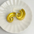Geometric retro design ear studs in gold and silver colours measuring 5cm