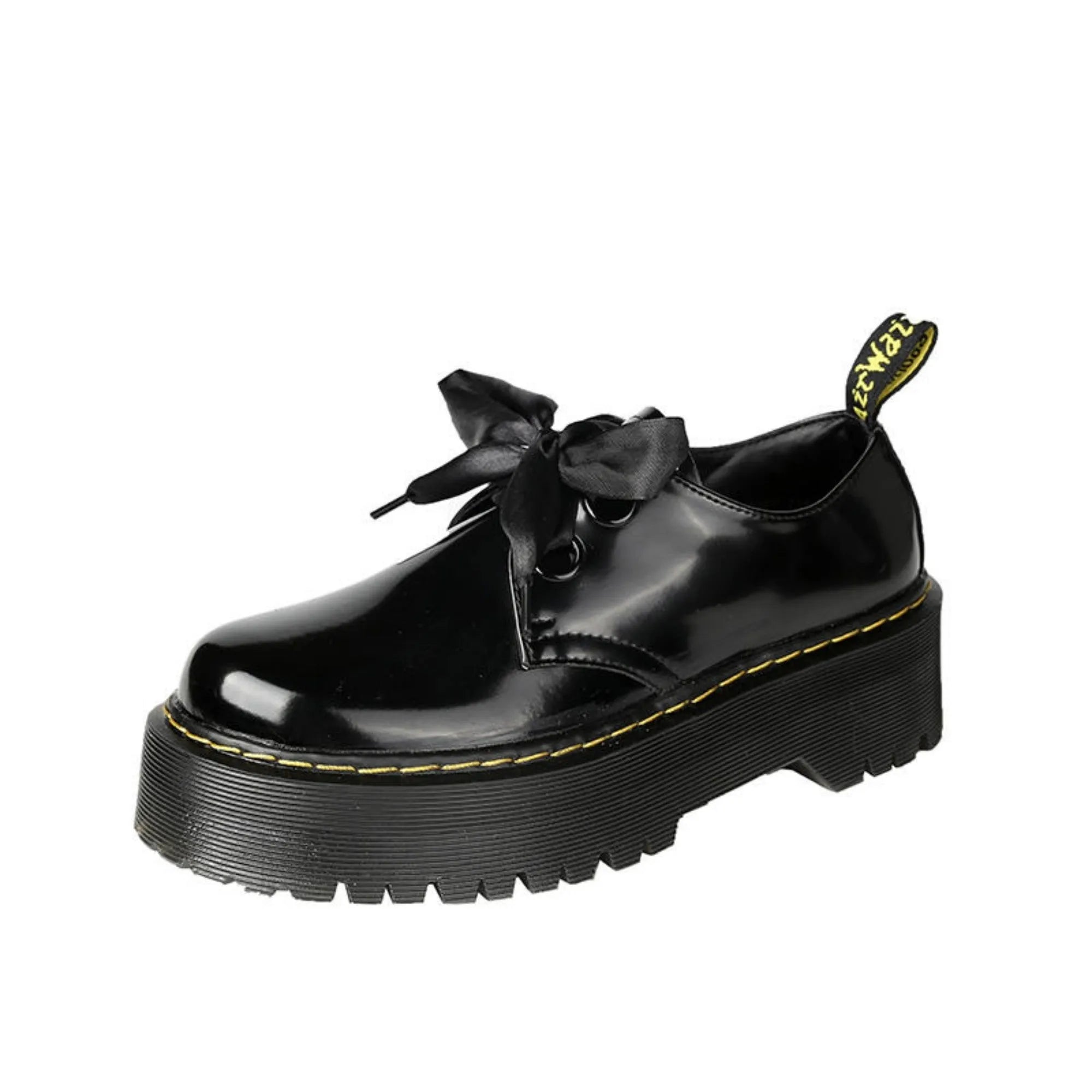 Women's black thick-soled lace-up shoes with ribbon and cross-strap design on a white background.