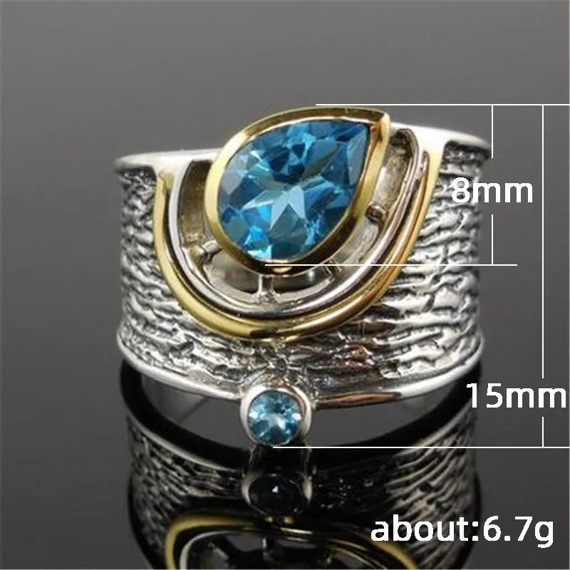 Blue zircon Chinese style women's ring with drop shape and rhinestone detailing on alloy band