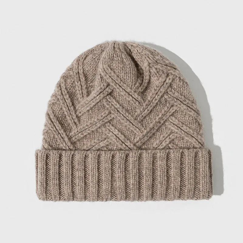 Woman wearing a wool knitted dome crown hat with a totem pattern in ankela red
