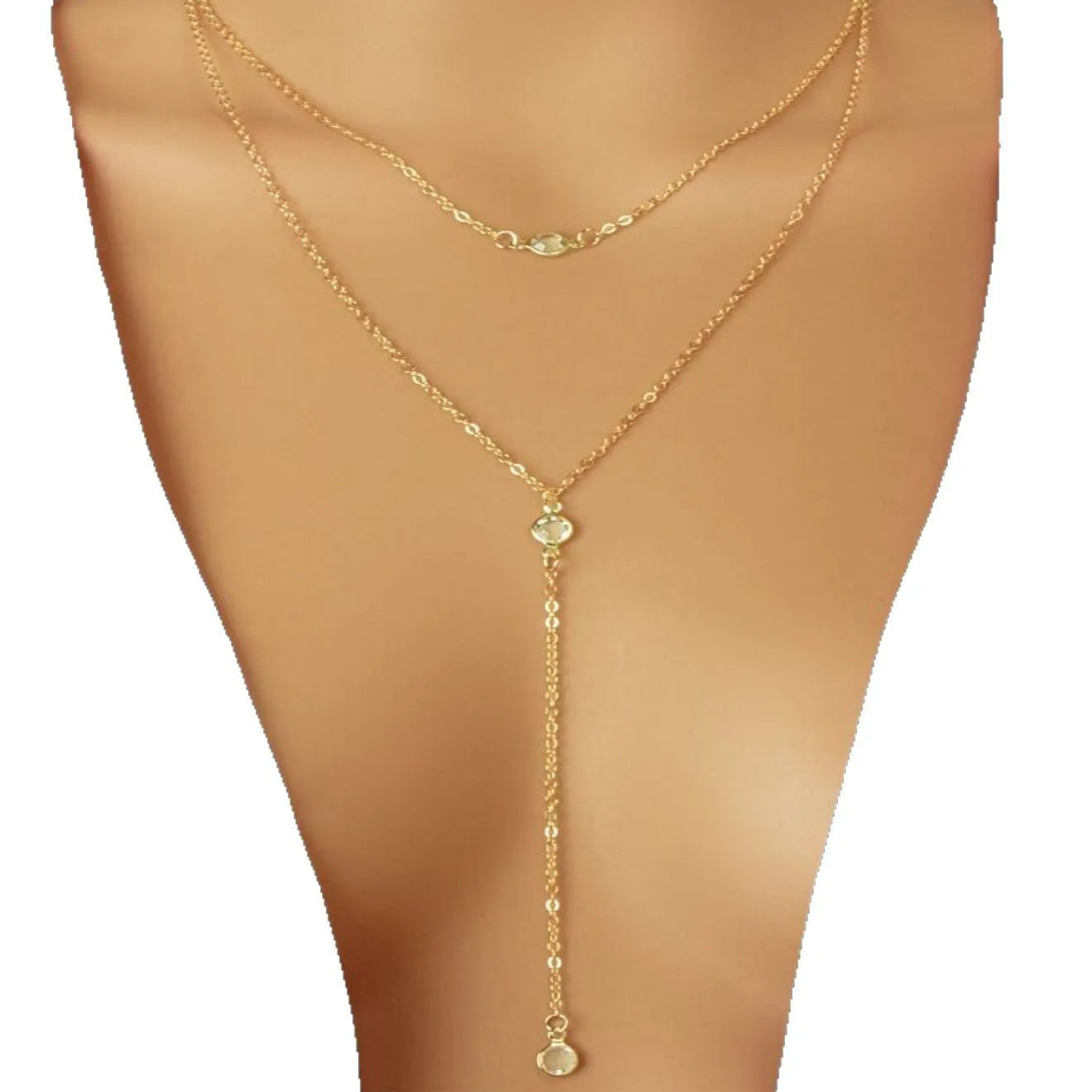 Female gold alloy O-ring chain necklace with geometric pendant on a light background