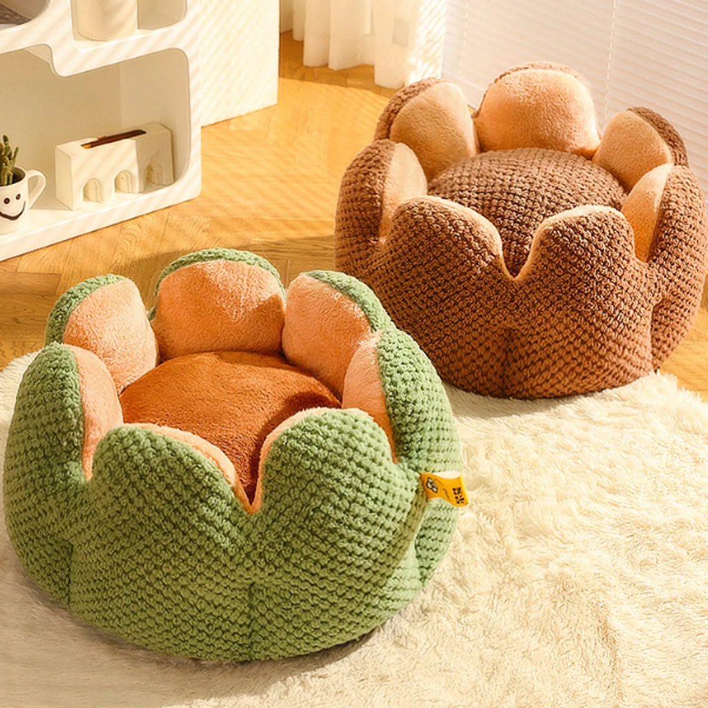 Green cactus petal shape plush kennel bed for cats and small dogs on a hardwood floor.
