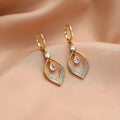 Women's gold and silver water drop tassel earrings with zircon detailing on thickened ear buckles