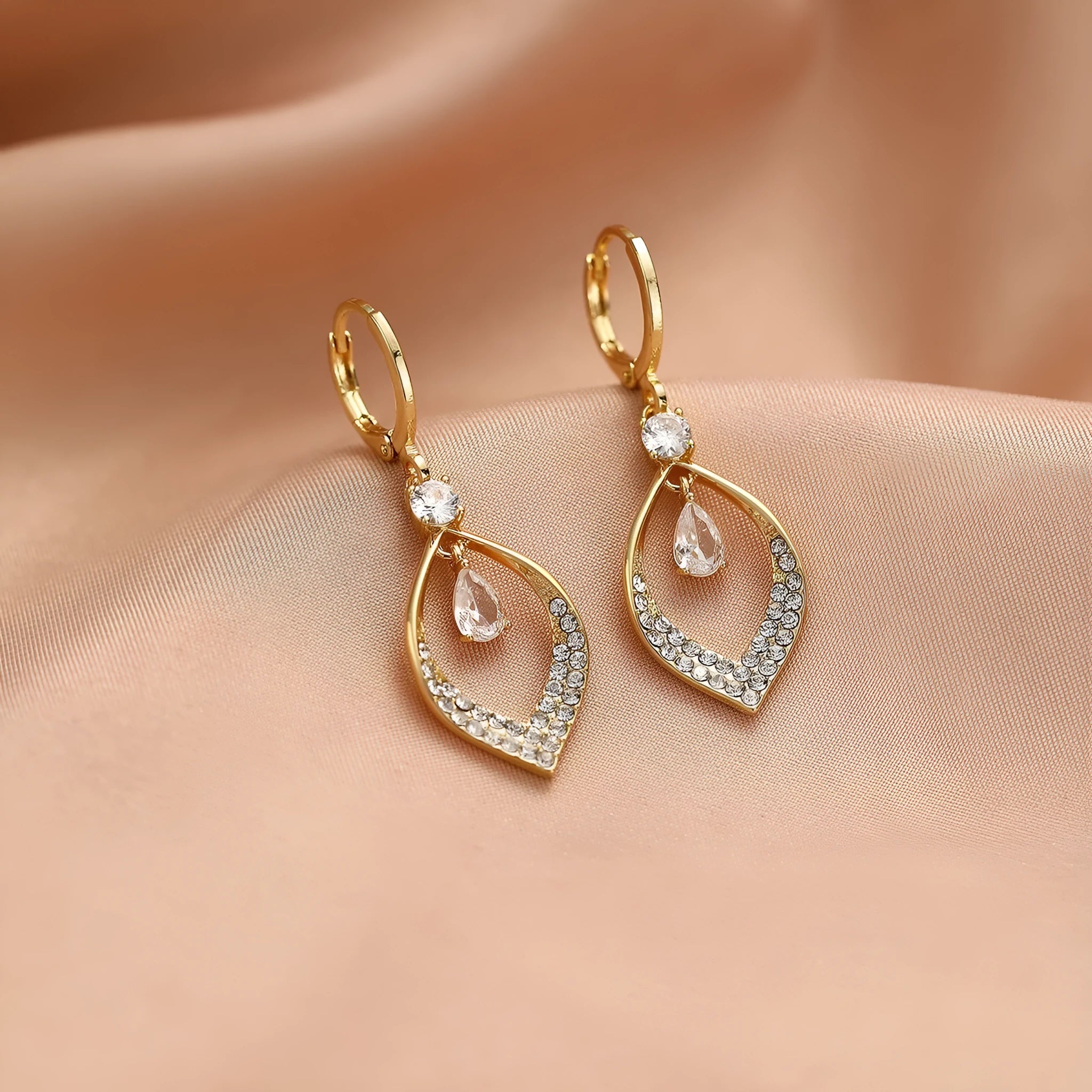 Women's gold and silver water drop tassel earrings with zircon detailing on thickened ear buckles