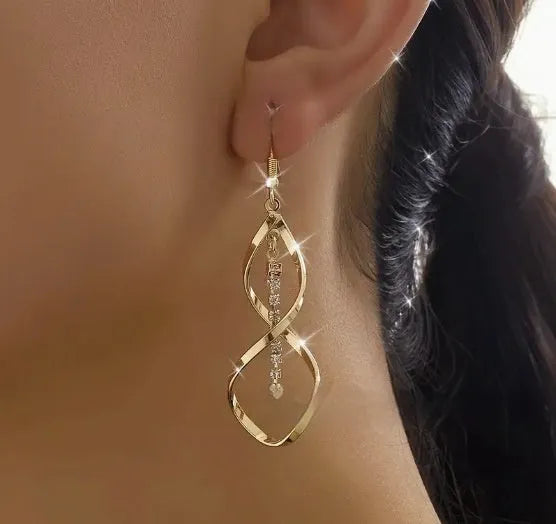 Geometric spiral design gold electroplated alloy earrings for women with ellipse decorative elements