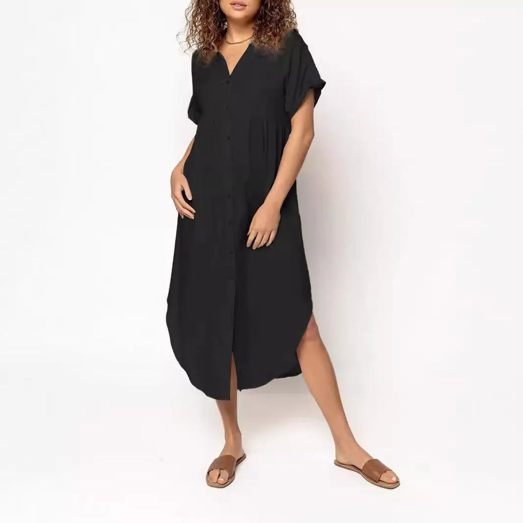 A loose-fitting, mid-length casual dress with button detail on the front, shown in a solid colour.