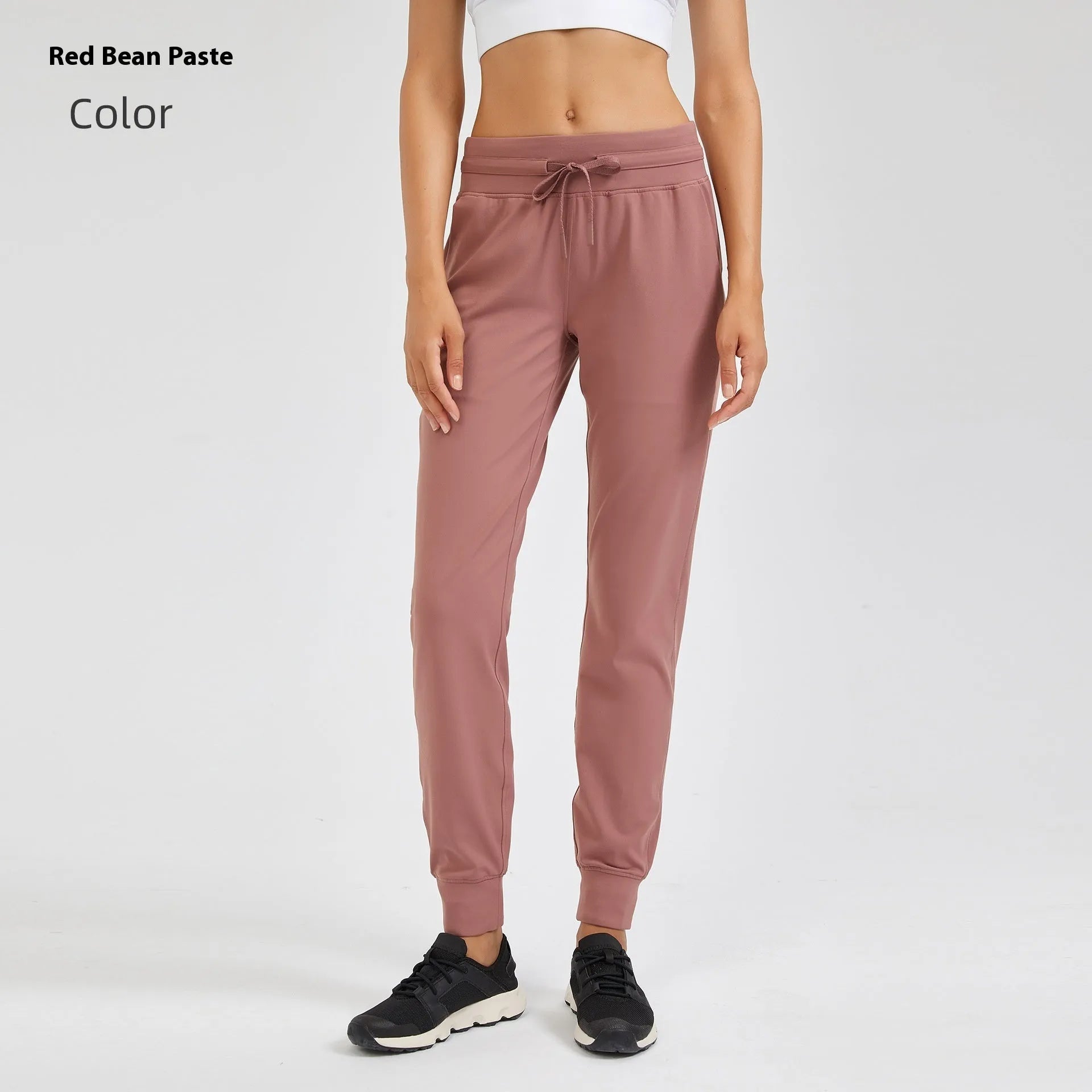 Women's high-waist yoga pants in distilled coffee colour with an elastic drawstring waist for fitness.
