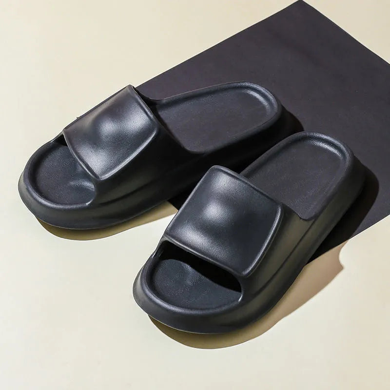 Soft EVA flip-flop slippers with thick sole in multiple colours on a white background.
