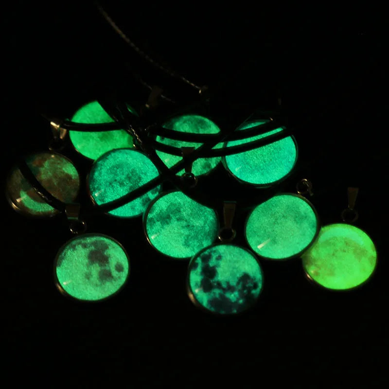 Luminous constellation pendant necklace with adjustable chain on a plain background.