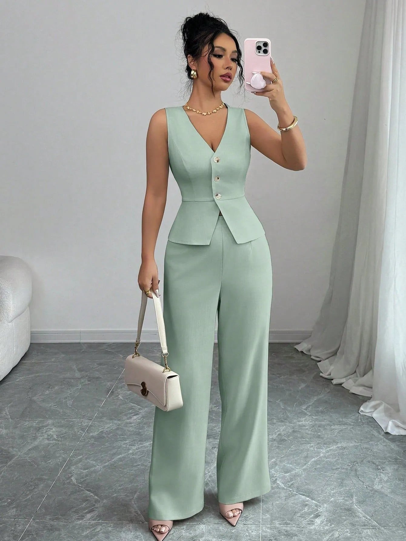 Women's solid colour sleeveless vest and high-waist trouser two-piece set in a casual style.