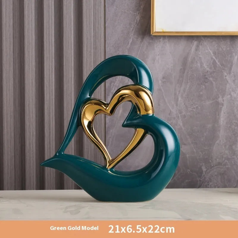 Modern geometric love heart ornament in white porcelain with metallic finish on display surface