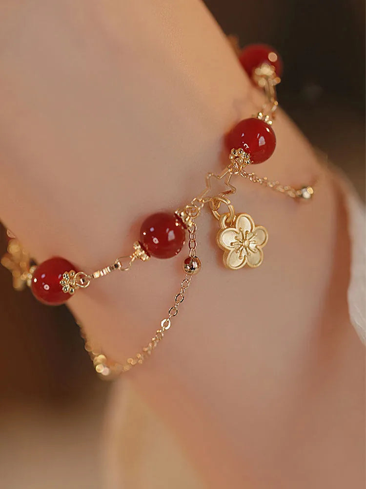 Red agate double layer bracelet with peach blossom charm and manual craftsmanship details