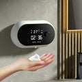 White automatic soap dispenser mounted on wall with infrared sensor and USB cable