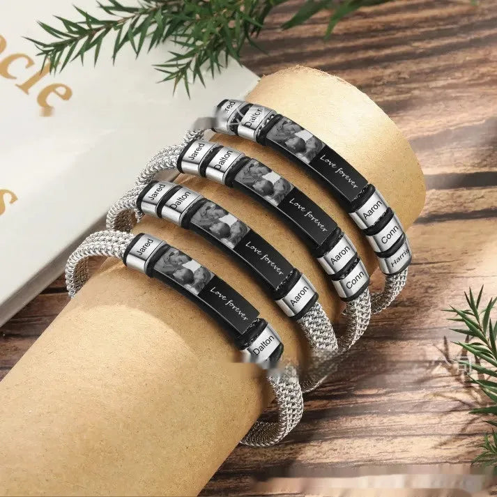 Men's titanium steel bracelet with leather rope band and heart-shaped lettering beads in a gift box.