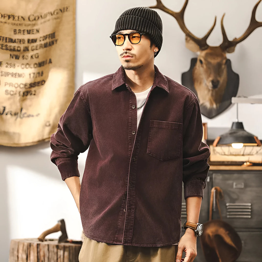 Men's black loose-fit retro corduroy shirt jacket with long sleeves.
