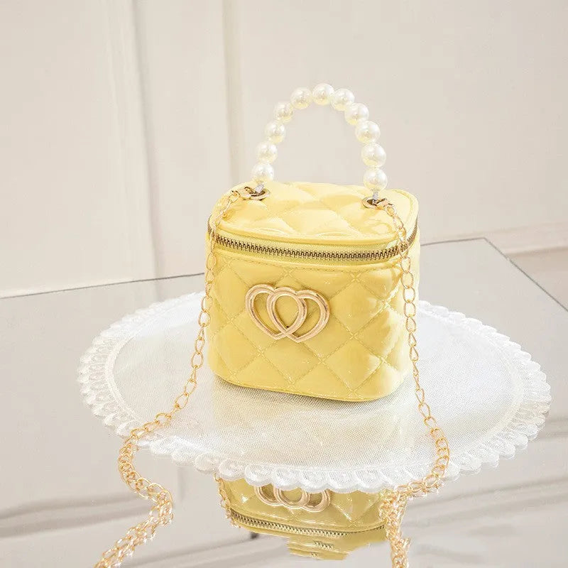Transparent PVC bucket bag with a heart pattern, shown in one of seven available colours.