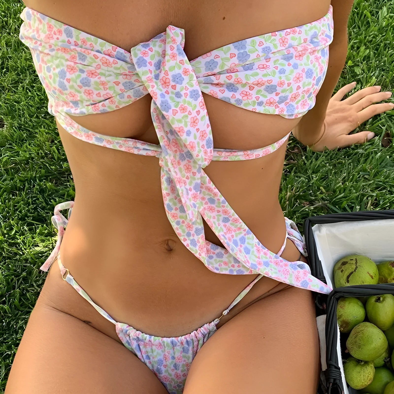 Women's lace-up front swimsuit with floral print and chest pad support