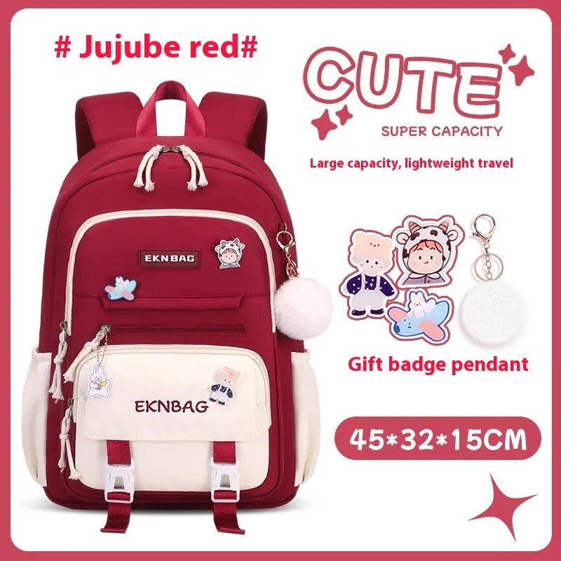 Pink waterproof Oxford cloth school backpack for girls with curved shoulder straps on a white background.