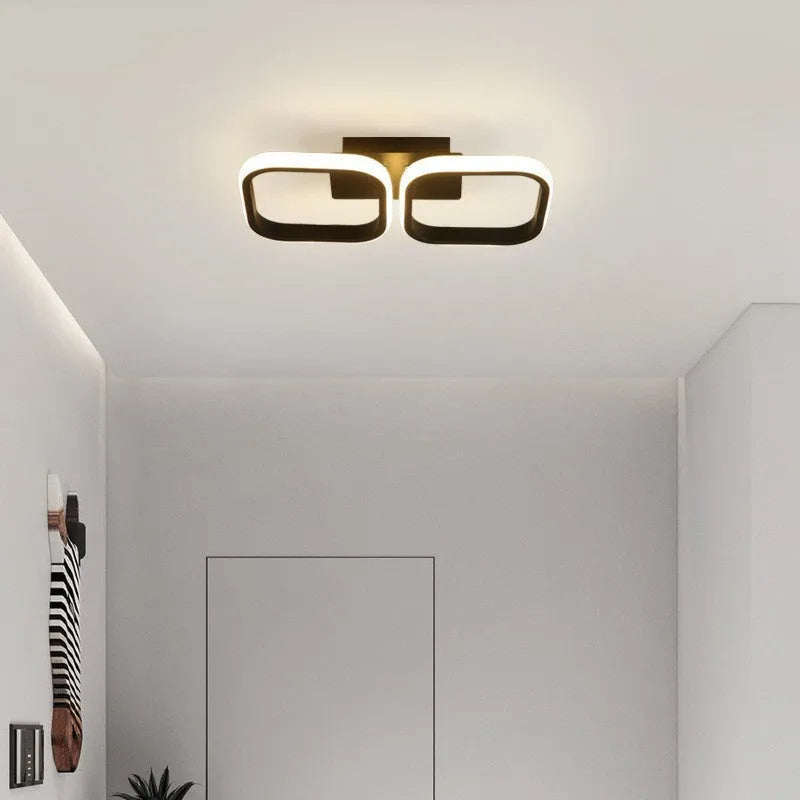 Modern simplicity hallway LED ceiling light in black with three round shapes over a corridor