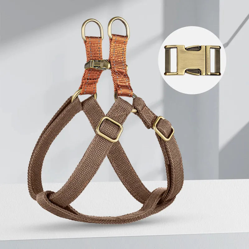 Brown vest-style anti-loss dog leash for a small dog, showing cotton belt and alloy fastener.